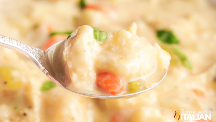 A spoon of creamy chicken and dumplings.