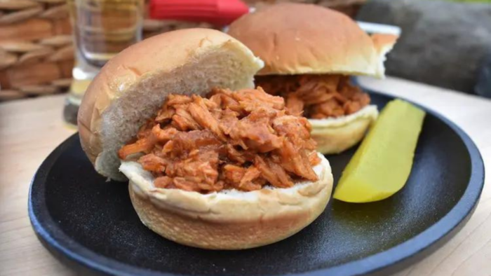 Pulled pork sandwiches on a plate.