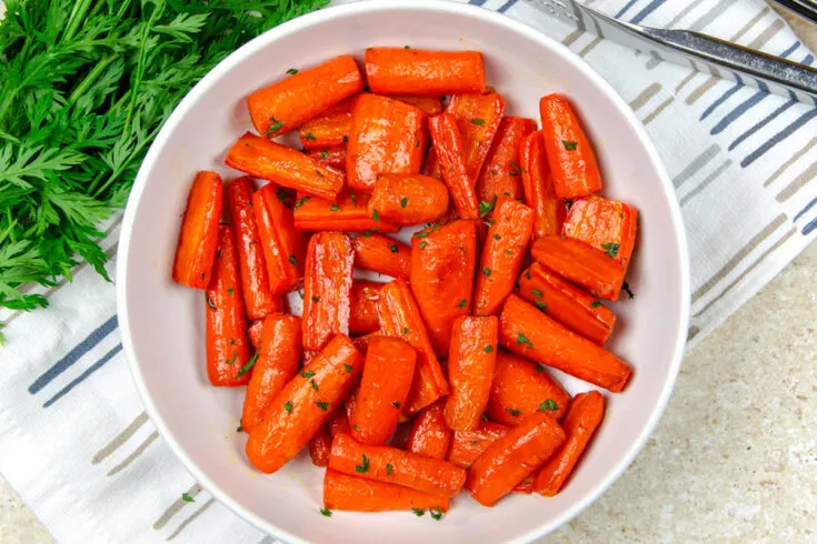 air fryer carrots in a white bowl.
