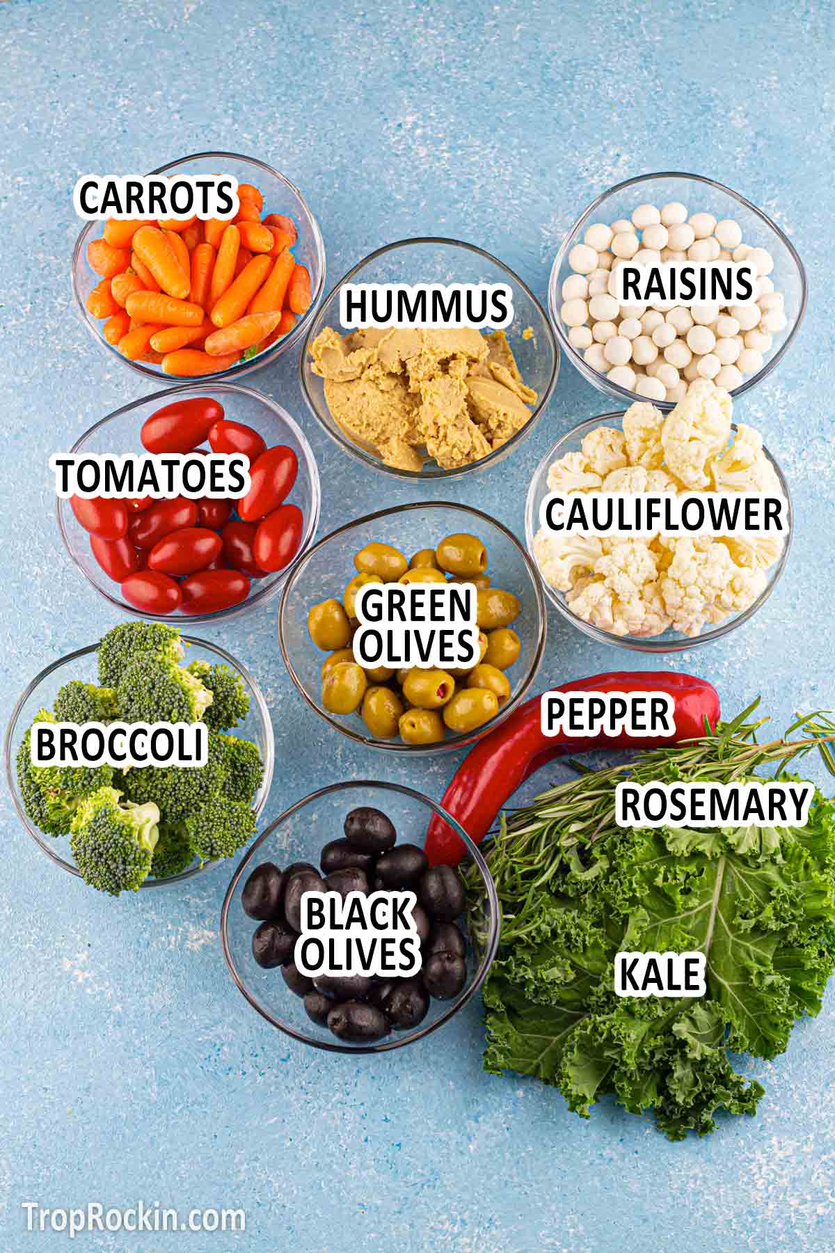 santa veggie tray ingredients displayed in clear bowls.