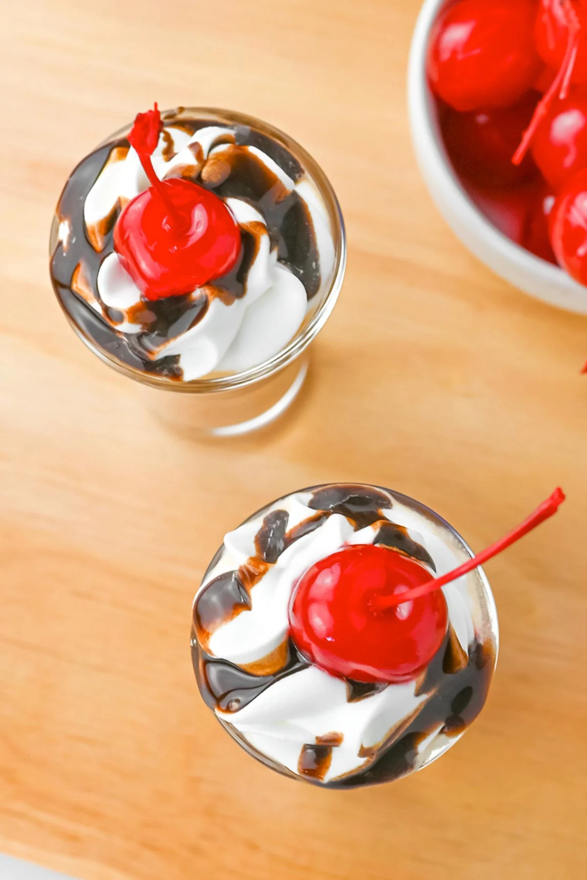 top view of two chocolate covered cherry shots.